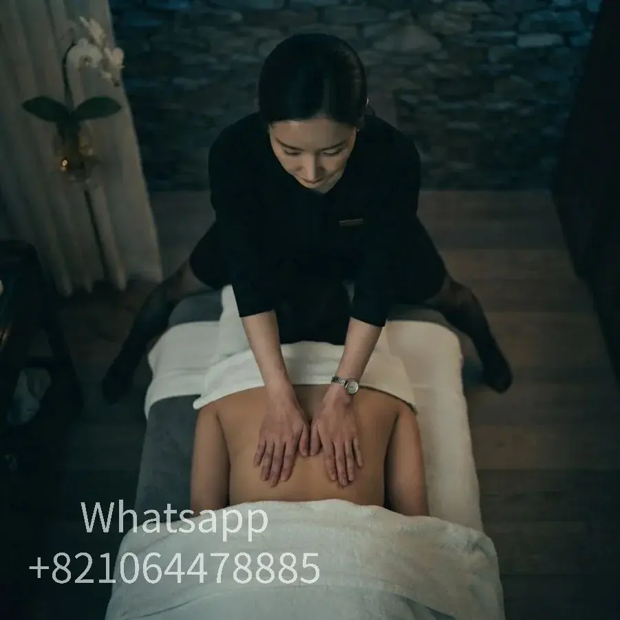 A private massage atmosphere with warm light and relaxed surroundings.